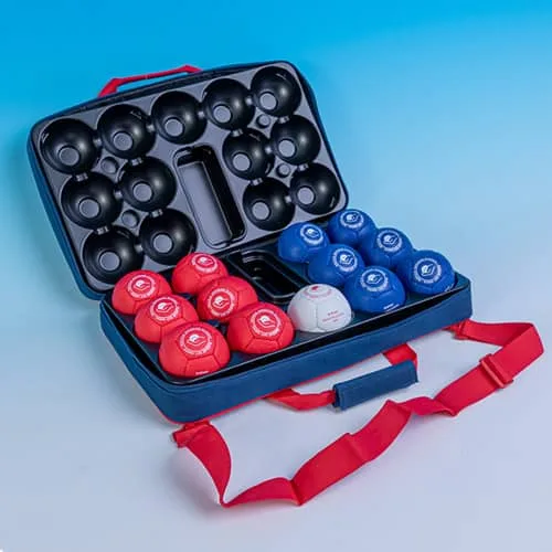 Open navy boccia case holding six red and six blue balls and one white target ball, with a red carry strap.