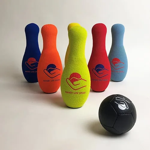 Five coloured foam bowling skittles with a black hand-sewn ball.