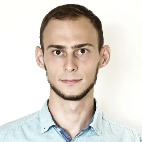 Tomasz Kłapsia in a light blue shirt, head and shoulders